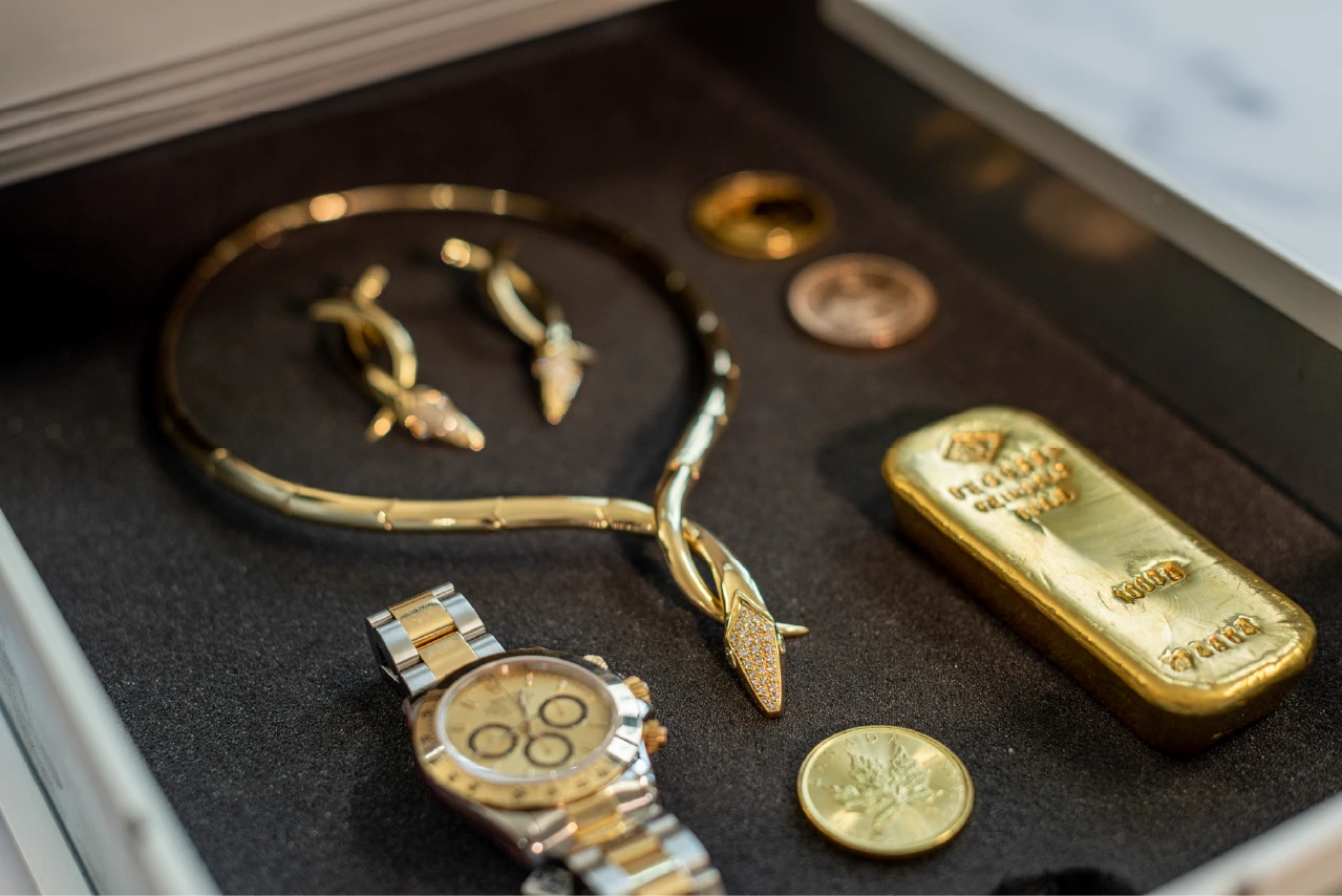 Gold bars, gold coins, jewelry and a high-quality wristwatch securely stored in a TRISOR safe deposit box.